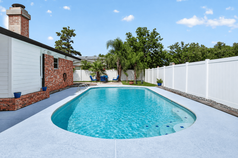 In-ground pool and fenced backyard at 6059 Karen St, Jacksonville, FL 32244