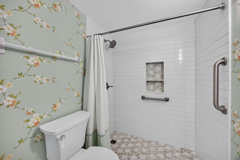 Shower with floral wallpaper accent at 2280 Shepard St