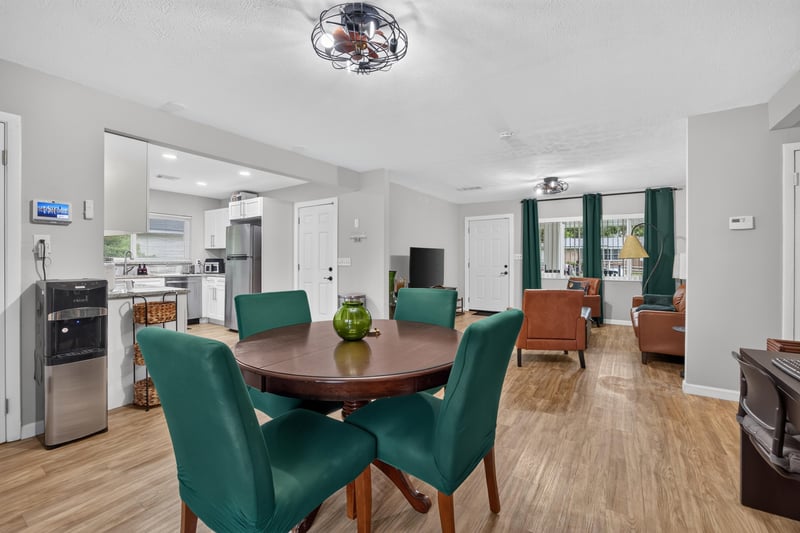 Open dining and kitchen area with stainless appliances at 9506 Harriet Ave, Jacksonville, FL 32208