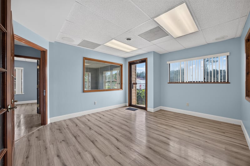 Room with French doors opening to hallway at 1543 Kingsley Ave #19, Orange Park, FL 32073