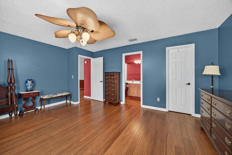 Bedroom with blue walls and red accent door at 4837 Pareja Ct, Jacksonville, FL 32225