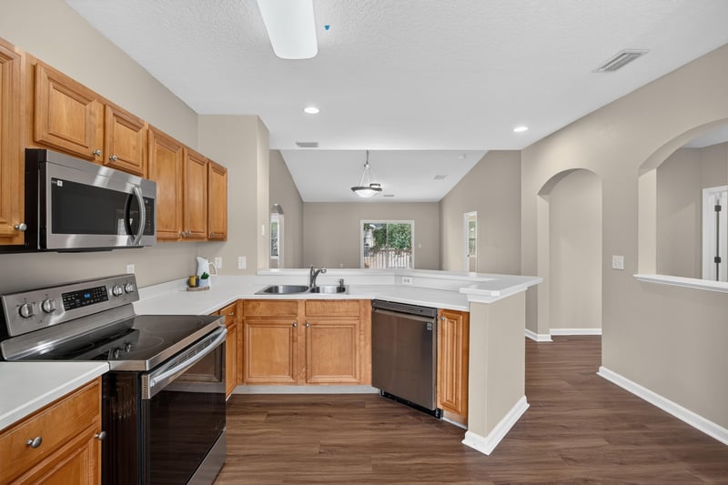 Kitchen with stove, dishwasher and sink at 3750 Silver Bluff Blvd, Orange Park, FL