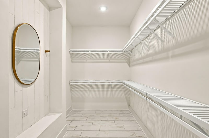 Primary closet with built-in shelving at 907 Seagrove Dr, Ponte Vedra Beach, FL 32081