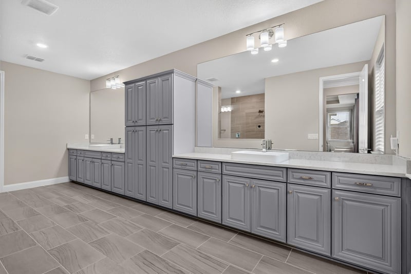 Primary bathroom with double vanity at 22 Azura Point