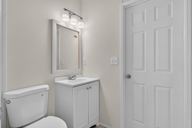 Bathroom vanity with mirror and toilet at 7603 Coach Park Dr, Jacksonville, FL 32244