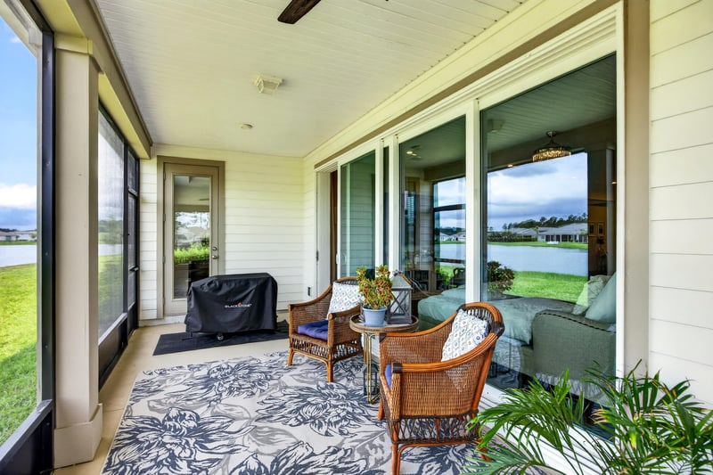 Screened porch with grill and seating at 85491 Fall River Pkwy, Fernandina Beach, FL 32034