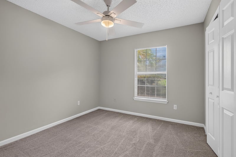 Bedroom with carpet and window at 12949 Chets Creek Dr S, Jacksonville, FL 32224