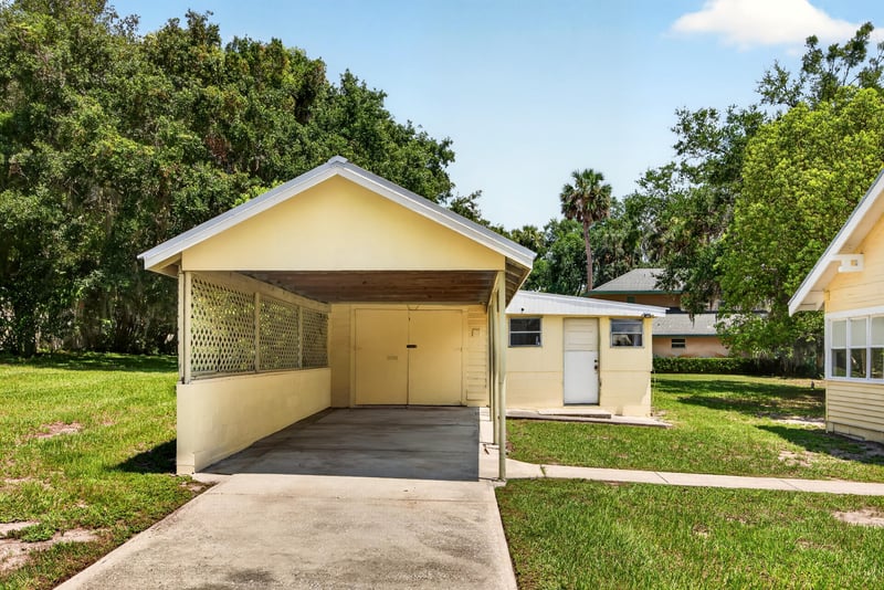 Carport and outbuilding on the lawn at 101 N Lake St, Crescent City, FL