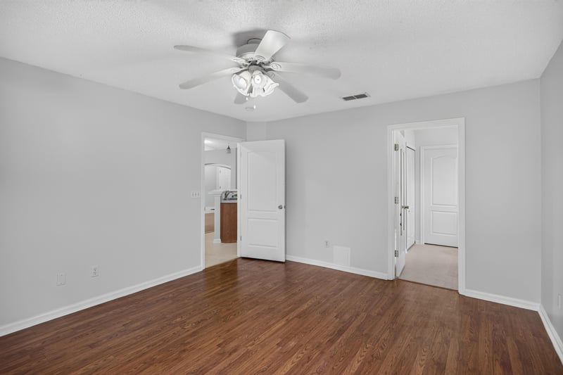 Bedroom area with multiple doors at 9691 Nelson Forks Dr, Jacksonville, FL 32222