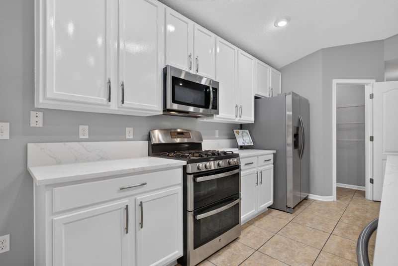 Kitchen range and microwave at 706 Grampian Highlands Dr, St. Johns, FL 32259