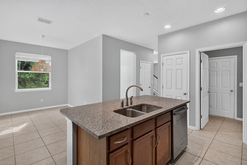 Kitchen sink island view toward dining area at 13685 Goodson Pl, Jacksonville, FL 32226