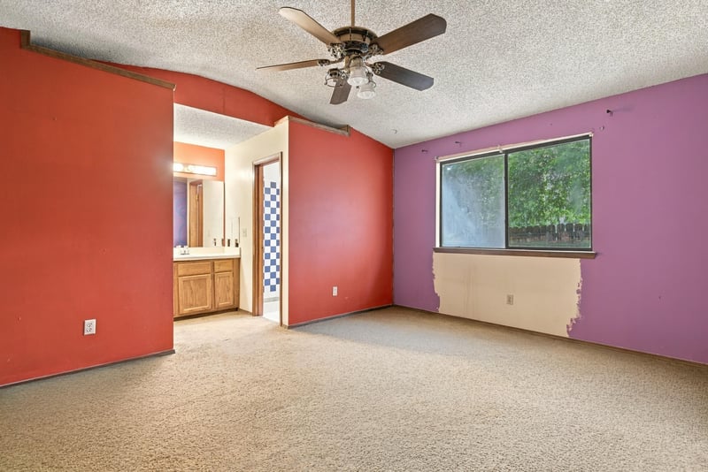 Bedroom with red accent wall and ceiling fan at 2915 Trenton Ct, Orange Park, FL
