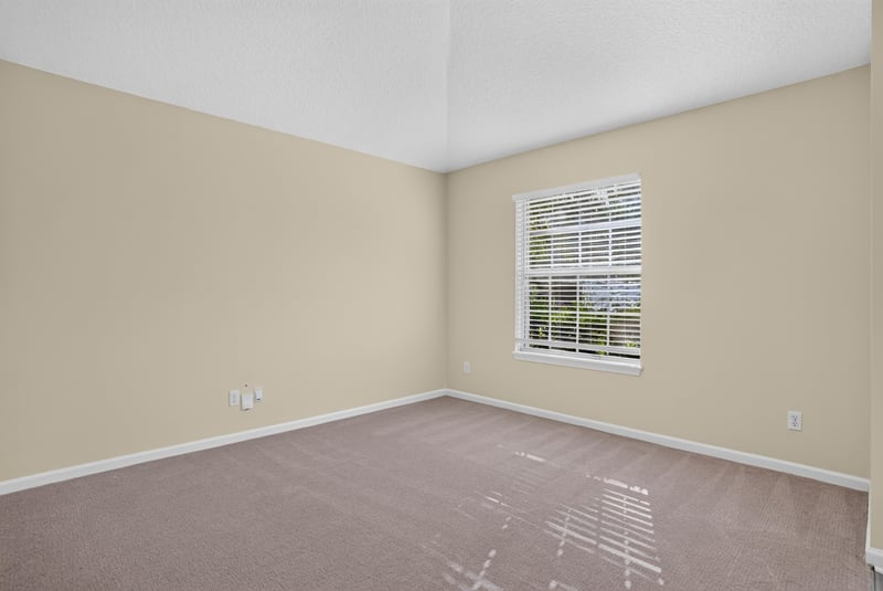 Bedroom with carpet and window at 299 John's Creek Pkwy, St. Augustine, FL 32092