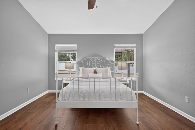 Bedroom with staged bed and window at 706 Grampian Highlands Dr, St. Johns, FL 32259