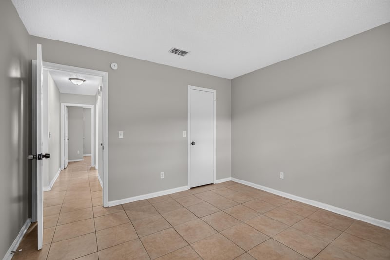 Hallway with closet doors at 1040 Willow Cove Ct E, Jacksonville, FL 32233