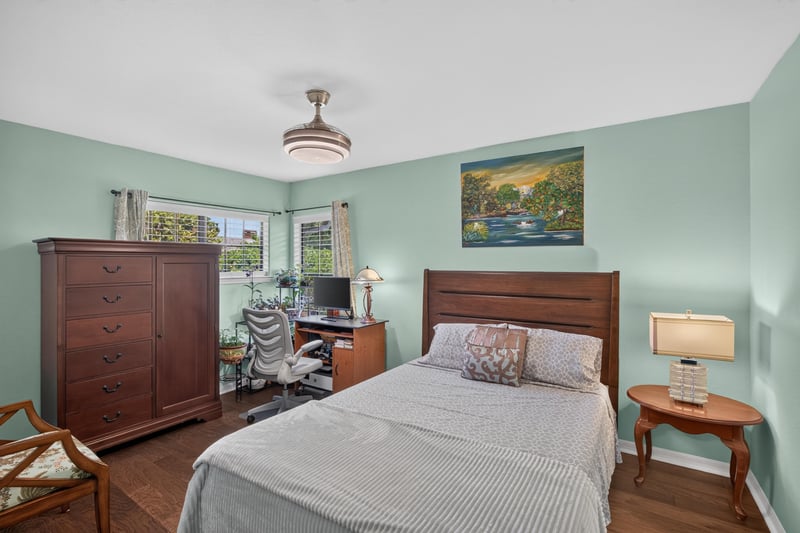 Bedroom with bed, dresser, and wall art at 10150 Belle Rive Blvd, Jacksonville, FL