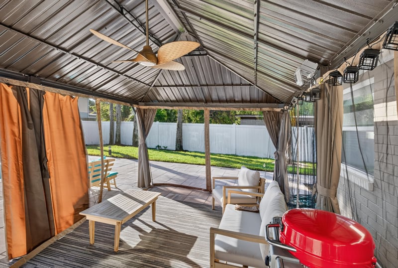 Covered patio with ceiling fan and slide at 1525 8th St N, Jacksonville Beach, FL