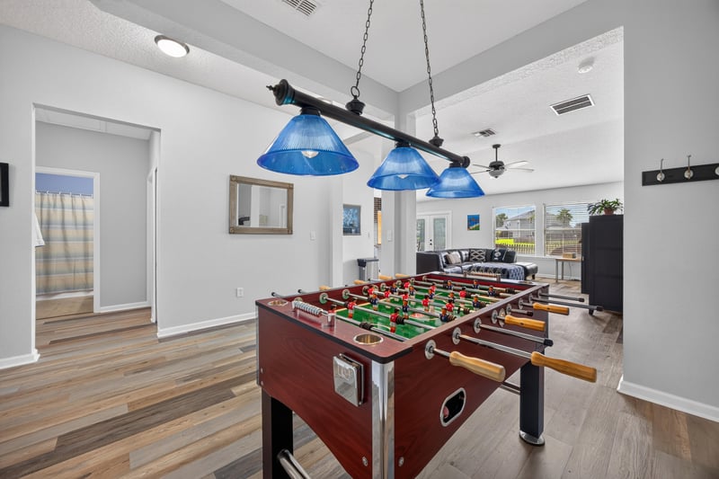 Game room with pendant lights and window at 2065 Creekmont Dr