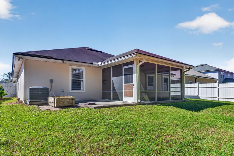 Rear exterior with screened porch, side angle at 14147 Fish Eagle Dr E, Jacksonville, FL 32226