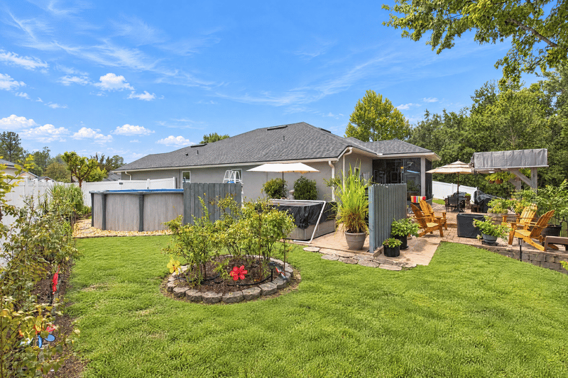 Backyard lawn and paver patio at 10923 Black Diamond Ct, Jacksonville, FL