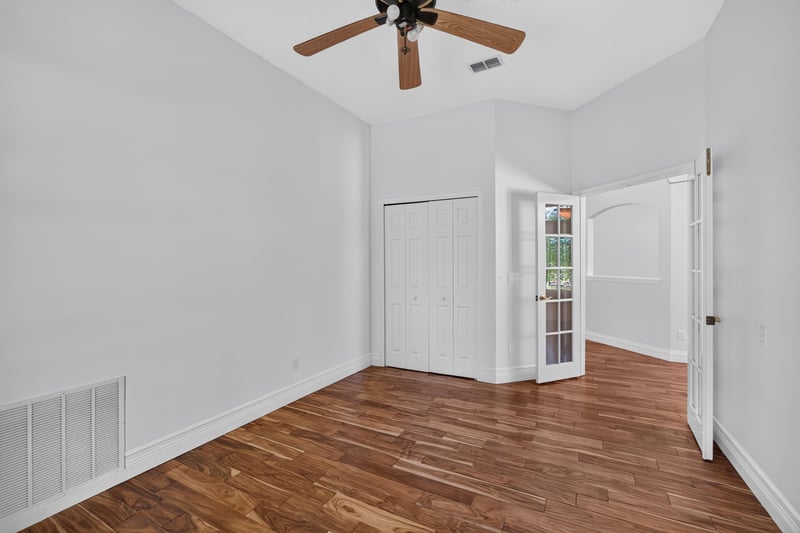 Bedroom with closet and wood floors at 11675 Magnolia Estates Rd, Jacksonville, FL 32223
