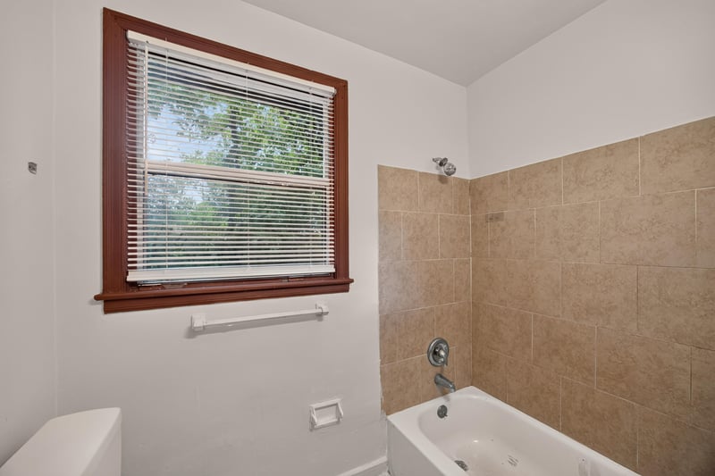 Bathroom with tub and tiled surround at 2132 Allandale Cir W, Jacksonville, FL