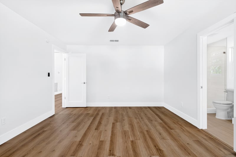Empty room with wood flooring and ceiling fan at 8453 Boysenberry Ln W, Jacksonville, FL