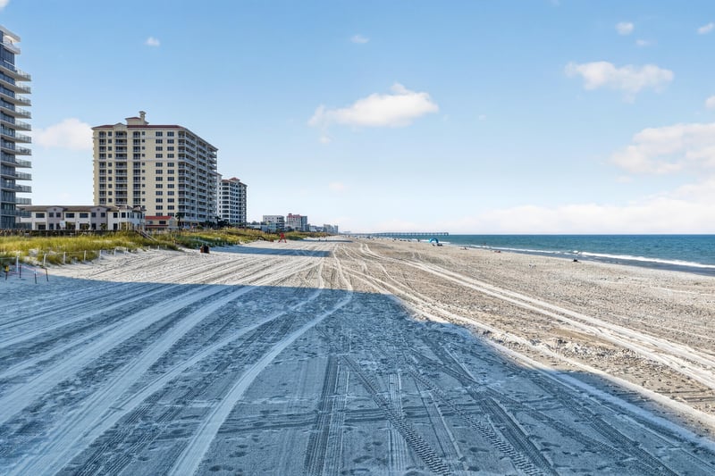 Aerial view of the beach with tire tracks in Jacksonville Beach