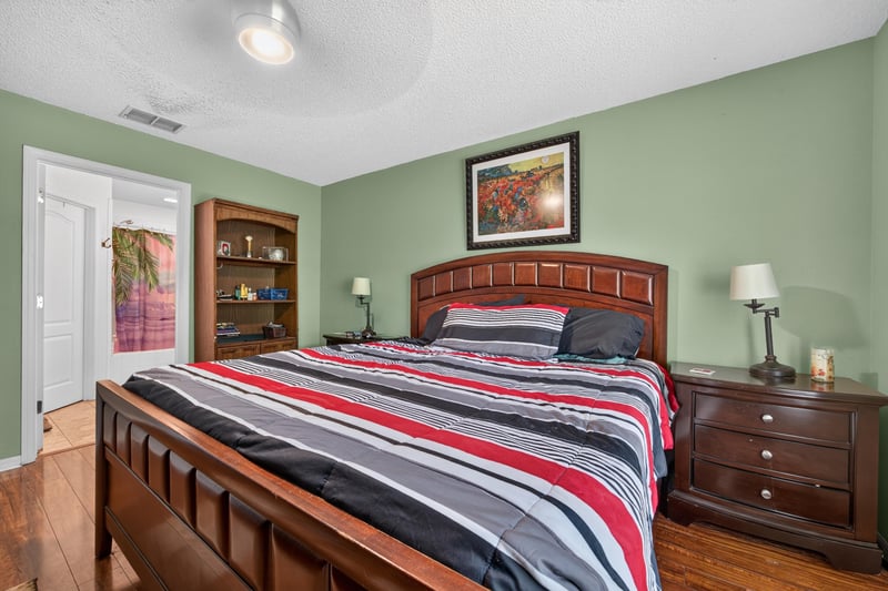 Bedroom with bookshelf and dresser at 145 Dover Bluff Dr, Orange Park, FL
