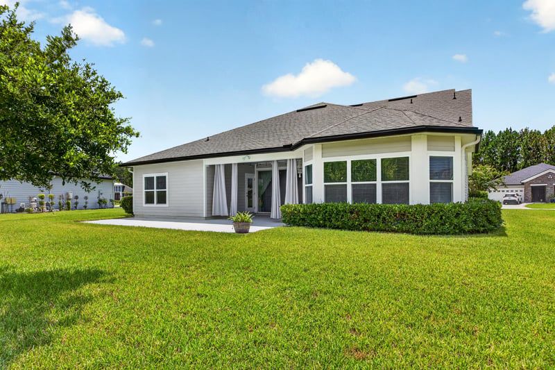 Rear exterior view of patio and windows at 53 Lumen Ct, St. Augustine, FL 32095