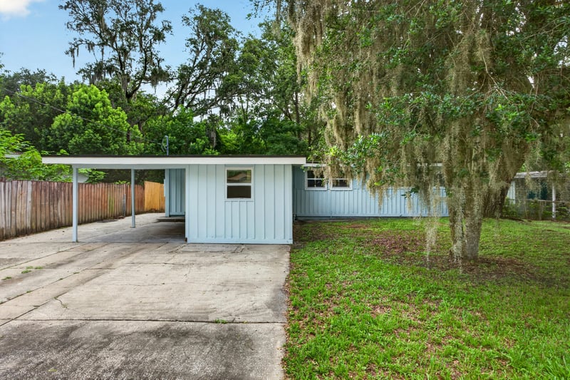 Front exterior with carport and concrete driveway at 3113 Kline Rd, Jacksonville, FL 32246