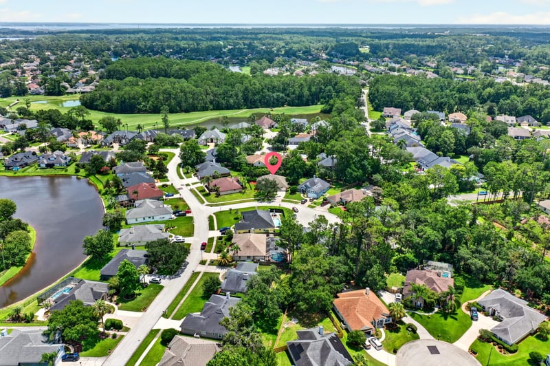 Aerial view of neighborhood and lake in Fleming Island, FL