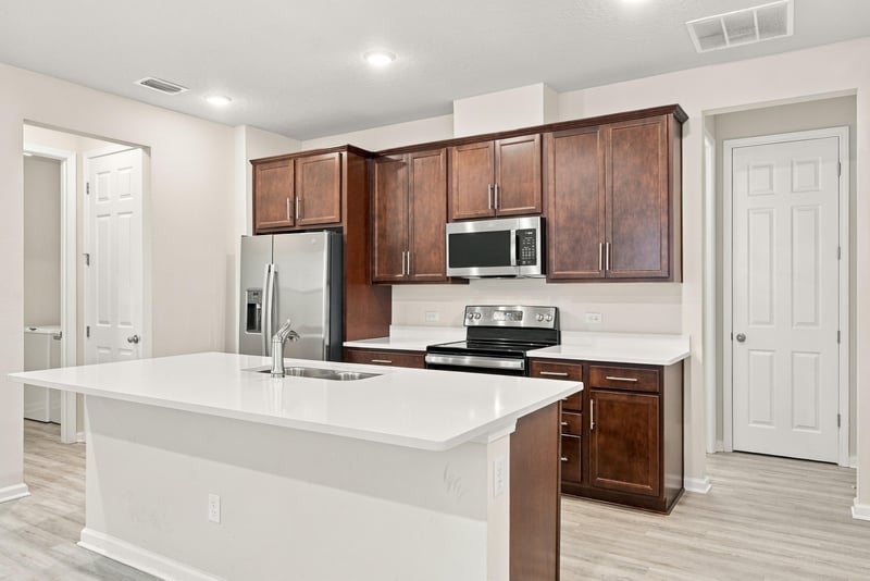 Kitchen with pendant lighting over the island at 7088 Mahogany Run Dr, Jacksonville, FL 32244