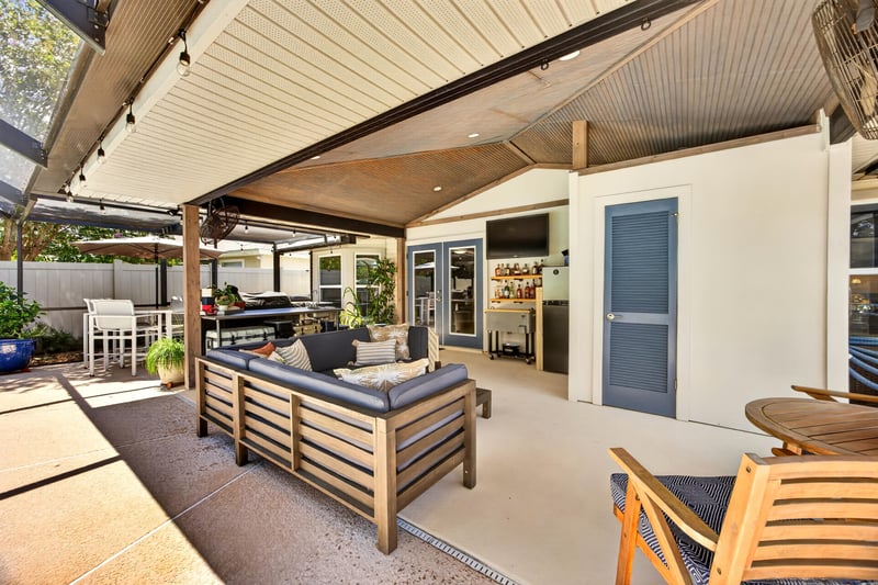 Covered patio lounge area at 1589 Backwater Drive, Middleburg, FL 32068