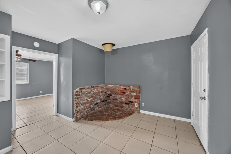 Room with brick accent wall and pass-through shelf at 6745 Jack Horner Ln, Jacksonville, FL 32210