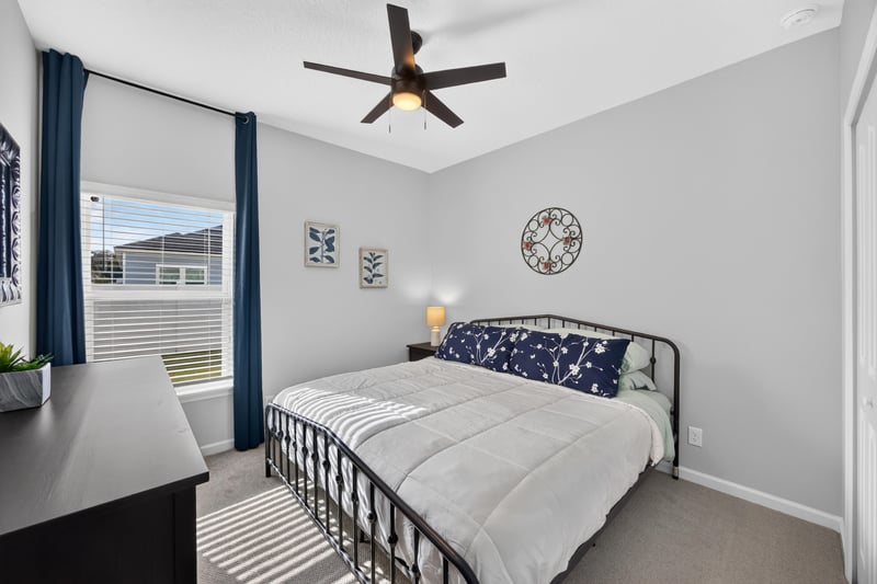 Bedroom with window and decorative clock at 2354 Jennings Farm Dr, Middleburg, FL 32068