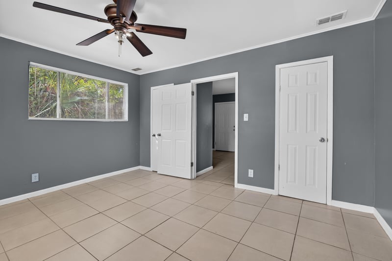 Hallway with closet doors and ceiling fan at 6745 Jack Horner Ln, Jacksonville, FL 32210