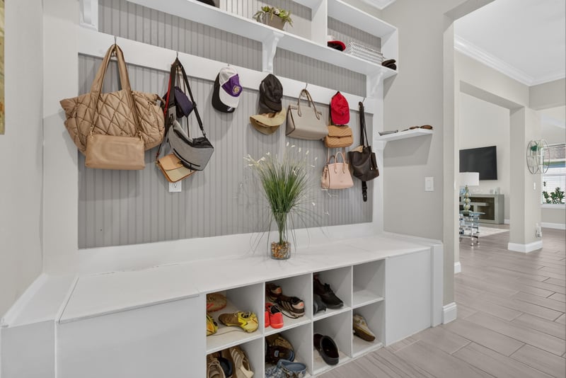 Mudroom with bench and wall hooks at 22 Azura Point