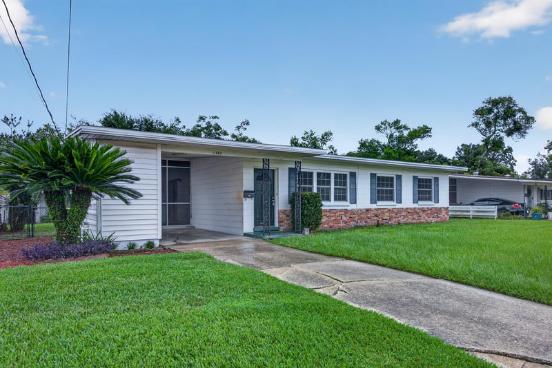 Front entry with landscaping and driveway at 11462 Elane Dr, Jacksonville, FL