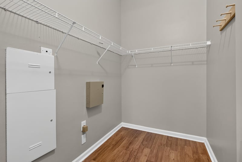 Laundry closet with shelving above washer-dryer hookup at 8196 Cabin Lake Cir, Jacksonville, FL 32256