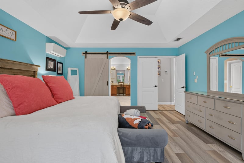 Primary bedroom sitting area with barn door at 2304 Spring Hill Ct, Orange Park, FL