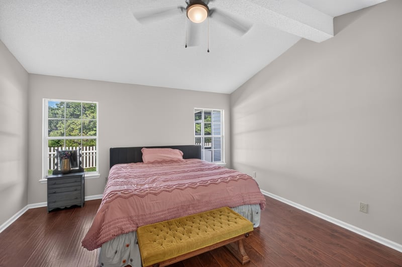 Bedroom with bed and bench at 11828 Heather Grove Ln, Jacksonville, FL