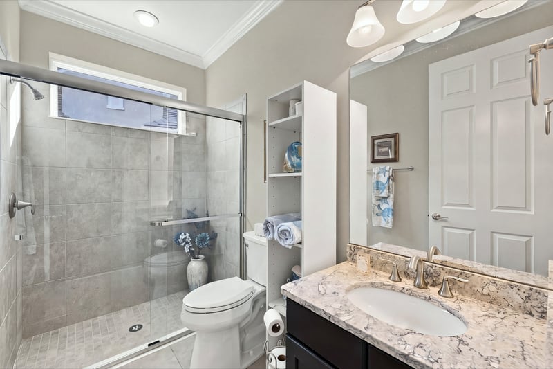 Secondary bathroom with glass shower, photographed by Megapixeler on Lucena Ln, Jacksonville, FL