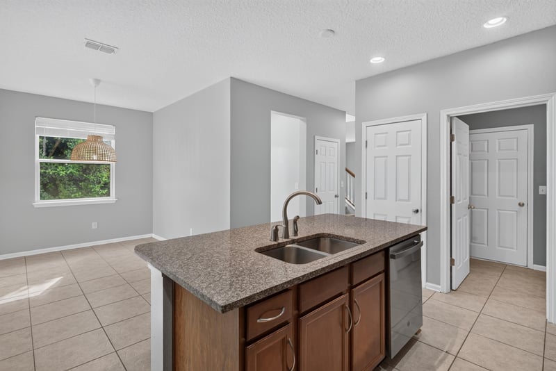 Kitchen sink island view toward dining area at 13685 Goodson Pl, Jacksonville, FL 32226