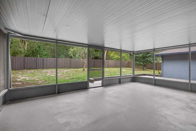 Screened porch with concrete floor at 551 Deltona Blvd, St. Augustine, FL 32086