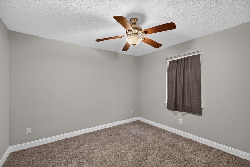 Carpeted bedroom with window at 12344 Cormorant Ct, Jacksonville, FL
