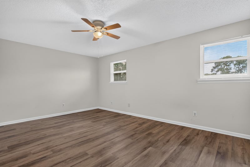 Empty room with wood floors and window at 4427 Millstone Ct, Jacksonville, FL