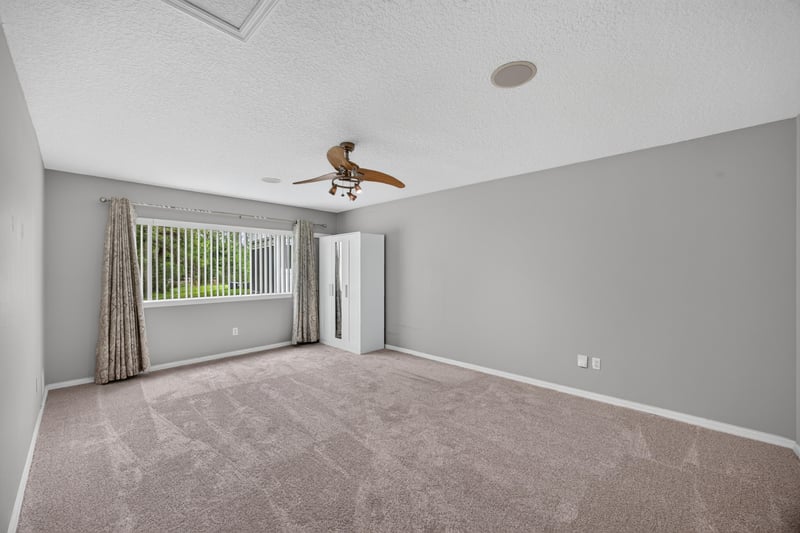 Bedroom with carpet and curtains at 635 Wakeview Dr, Orange Park, FL 32065