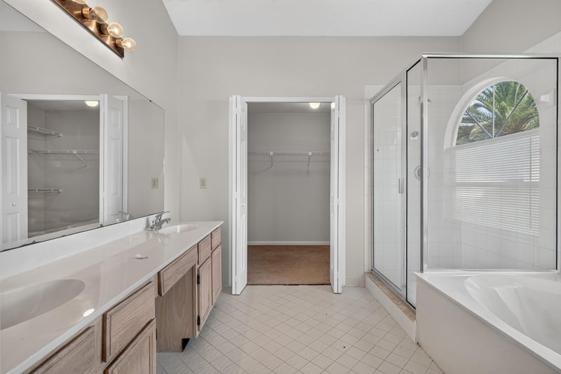 Primary bathroom with dual-sink vanity and glass shower at 400 Ashcroft Landing Dr, Jacksonville, FL 32225