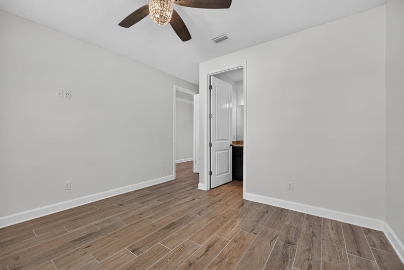 Bedroom with wood floors at 855 Flach Dr, St. Johns, FL